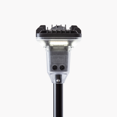 Devos LightRanger 2000 telescoping LED area light with clear housing and black top, illuminated.