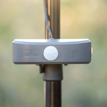 Devos LightRanger USB-C motion sensor module, dark gray with a white dome sensor, mounted on a pole.