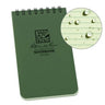 Green 3x5 Rite in the Rain top spiral notebook with a close-up of water beading on its grid paper.