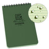 Green 4x6 Rite in the Rain top spiral all-weather notebook with a close-up of water beading on its lined paper.