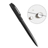Matte black metal all-weather pen with a clip, shown next to water droplets on paper.