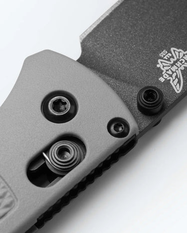 Close-up of a storm gray Grivory handle and black Cerakote S30V blade of an ultralight folding knife.