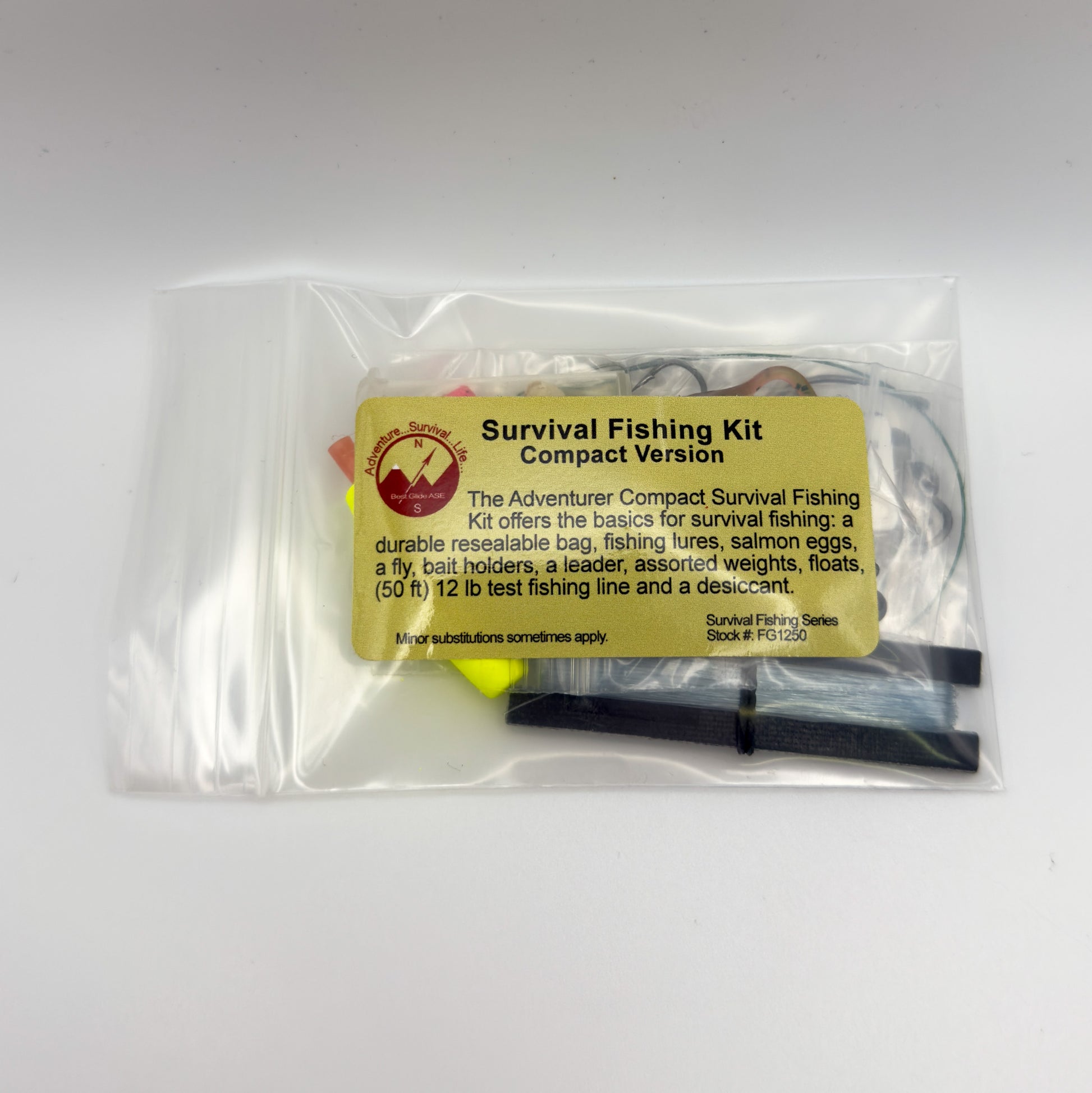 Survival Fishing Kit Compact Version in a clear resealable plastic bag with a yellow label, photographed on a plain light background.