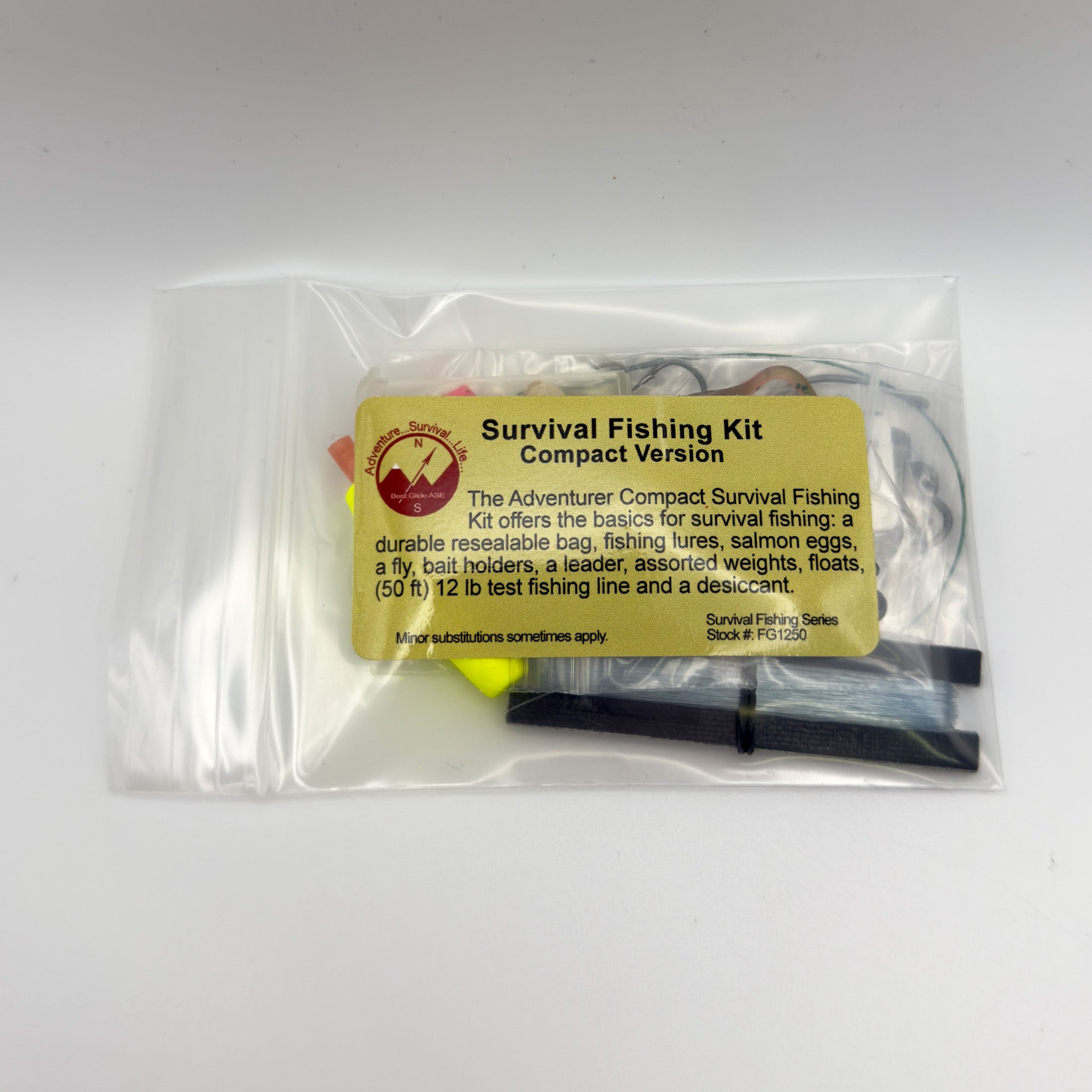 Survival Fishing Kit Compact Version in a clear resealable plastic bag with a yellow label, photographed on a plain light background.