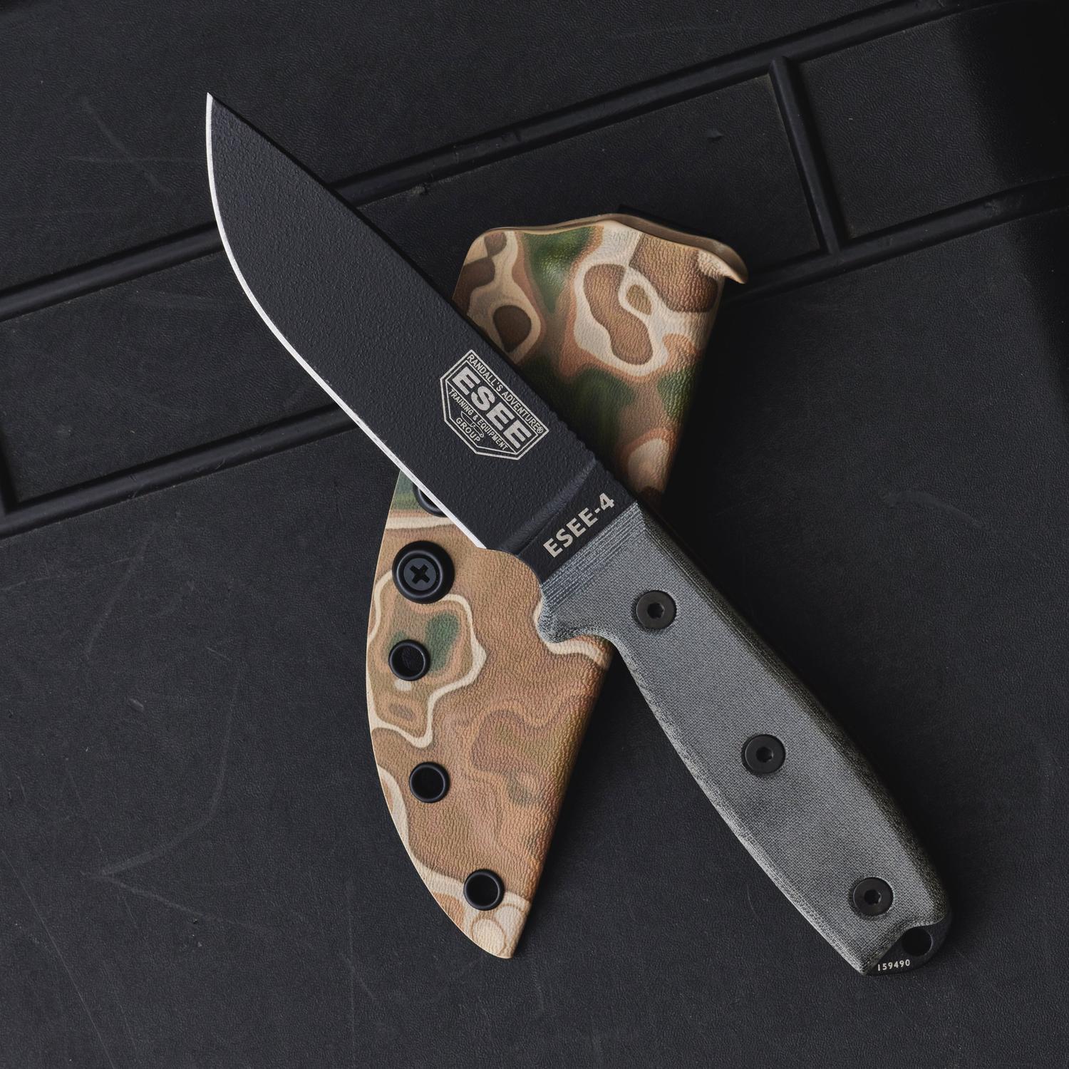 ESEE-4 knife with black blade and gray handle, partially inserted into a RELV Camo Moab Kydex sheath.