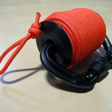Drop-Line RLD System with black Delrin reel, matte black carabiner, and bright orange 550 paracord.