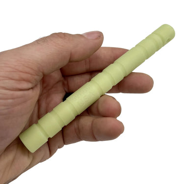 Hand holding a 6-inch pale green glow-in-the-dark nylon Kubaton with ribbed grip and "GVKBG USA" text.