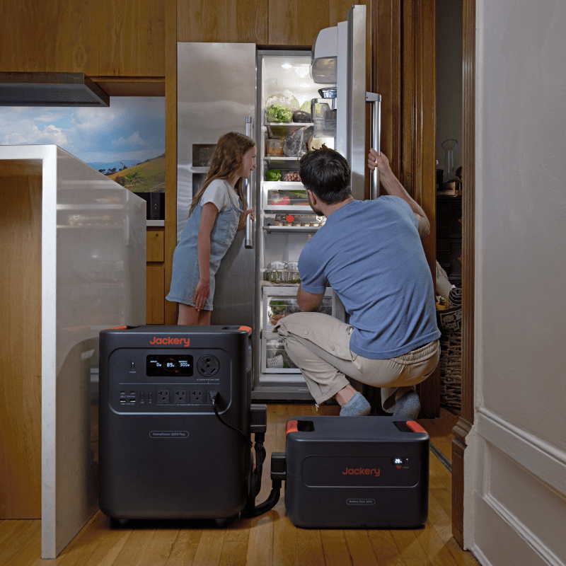 Jackery HomePower 3600 Plus and Battery Pack 3600 powering a stainless steel refrigerator.
