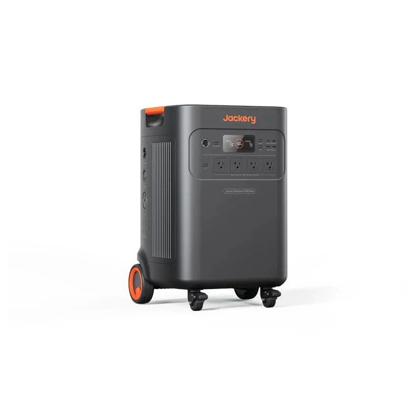 Jackery Explorer 5000 Plus portable power station, dark gray with orange accents, wheels, and multiple outlets.