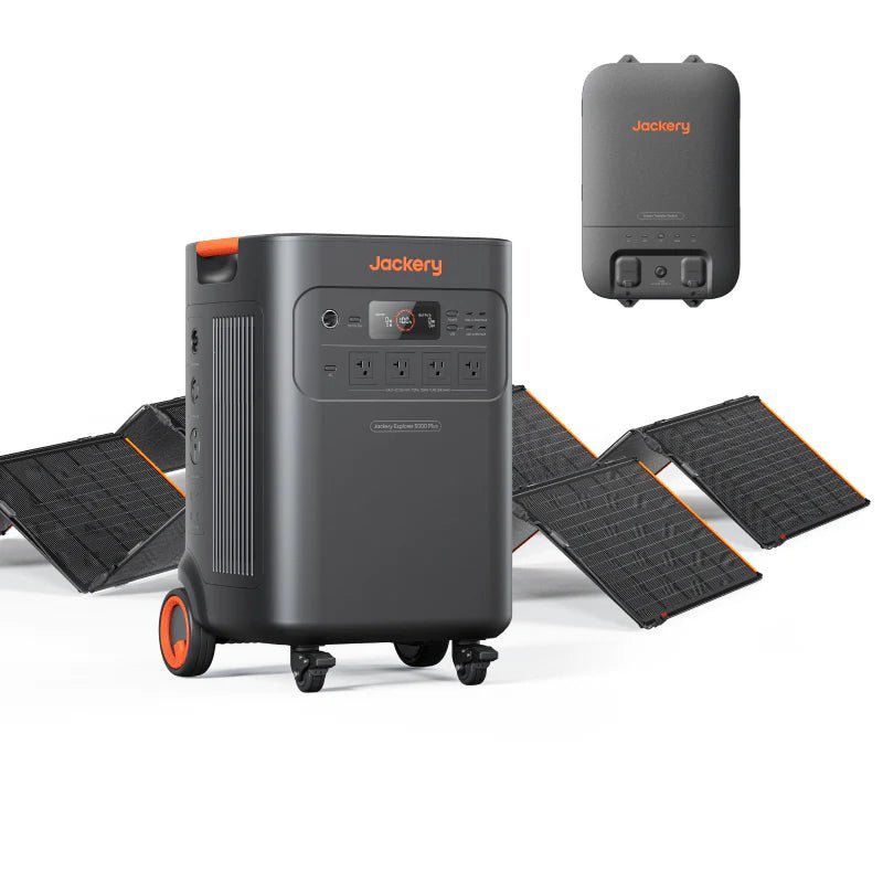 Jackery Explorer 5000 Plus Double Kit: dark gray portable power station with orange accents, four solar panels, and a smart transfer switch.