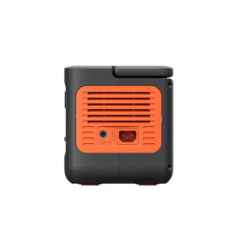 Jackery Explorer 300 v2 portable power station, black with orange vents and power input ports.