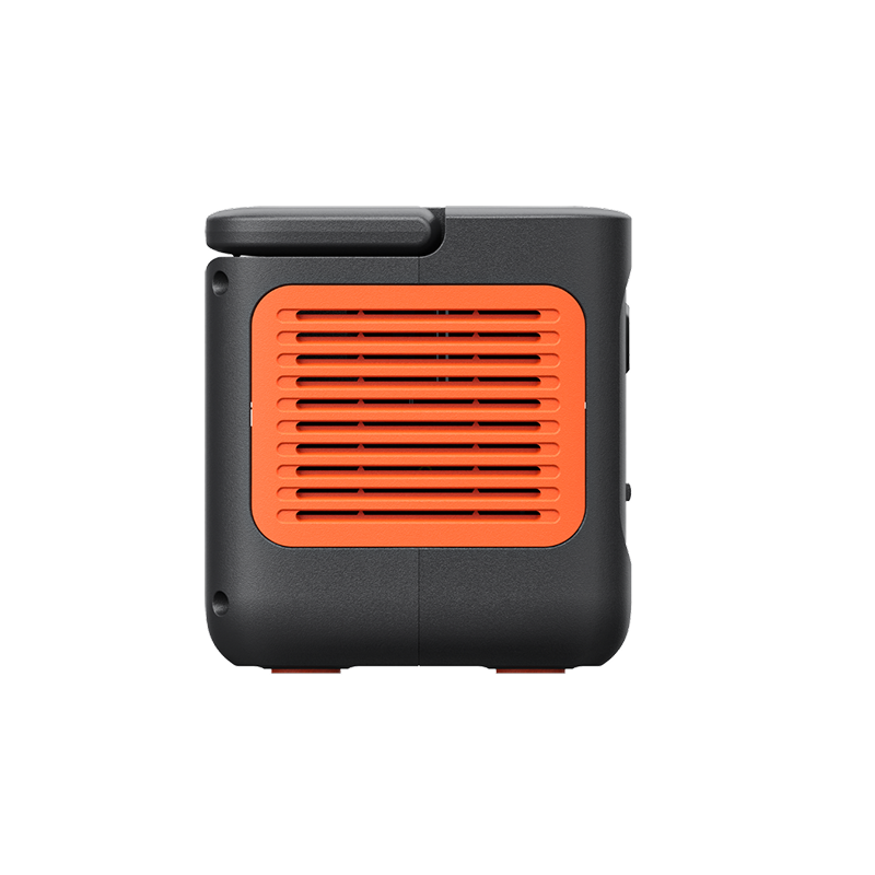 Jackery Explorer 300 v2 portable power station, black with orange side vents and handle.