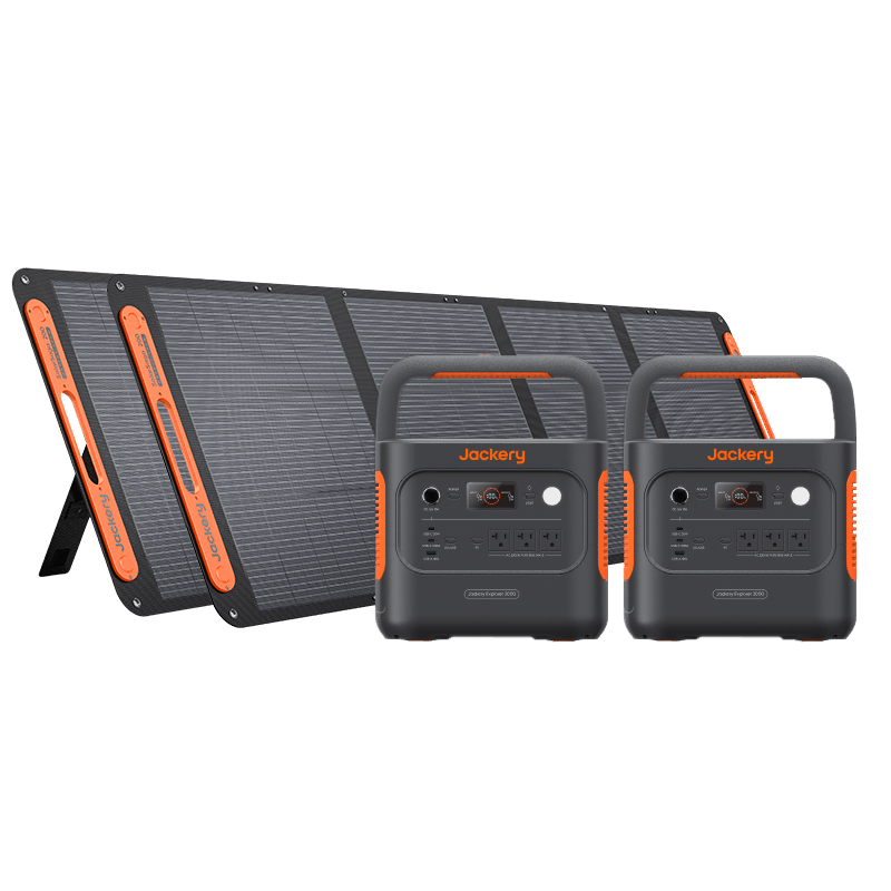 Jackery Solar Generator 2000 v2 with two dark gray portable power stations and two black solar panels.