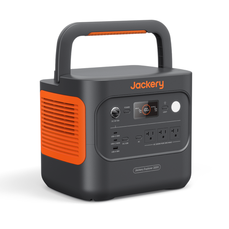 Jackery Solar Generator 2000 v2 in dark gray and orange with multiple power outlets and a digital display.