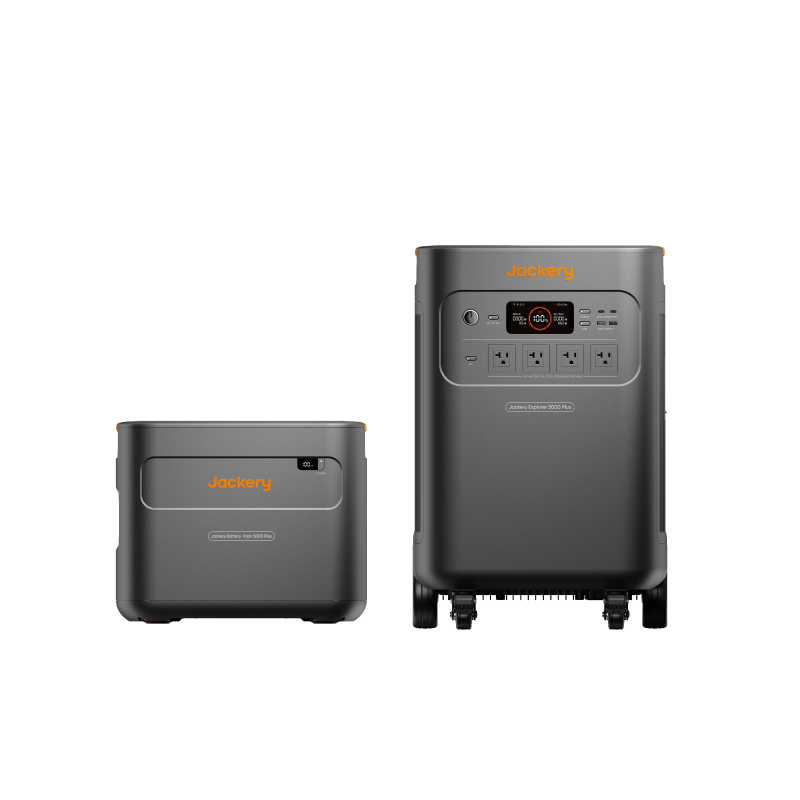 Jackery Whole-Home Backup Kit 5000 Plus, featuring a dark gray portable power station with orange accents and a smaller battery pack.