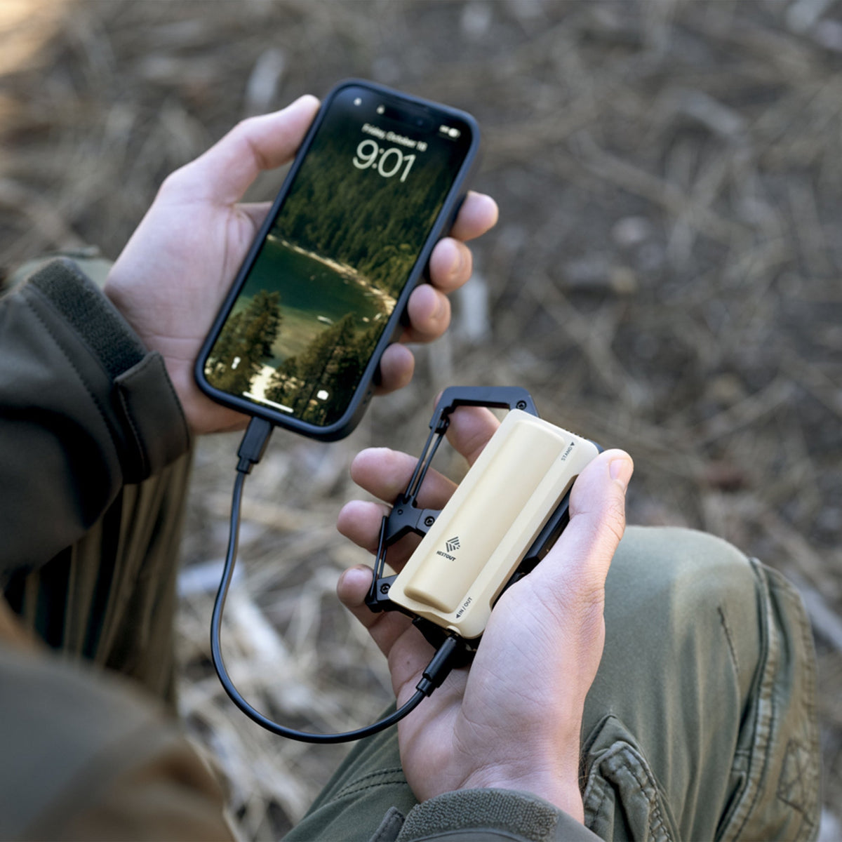 Carabiner Battery with retractable phone stand in use