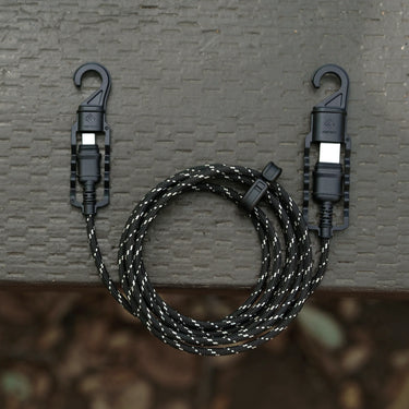 Black and white braided outdoor USB-A to USB-C charging cable with protective caps and integrated hooks.
