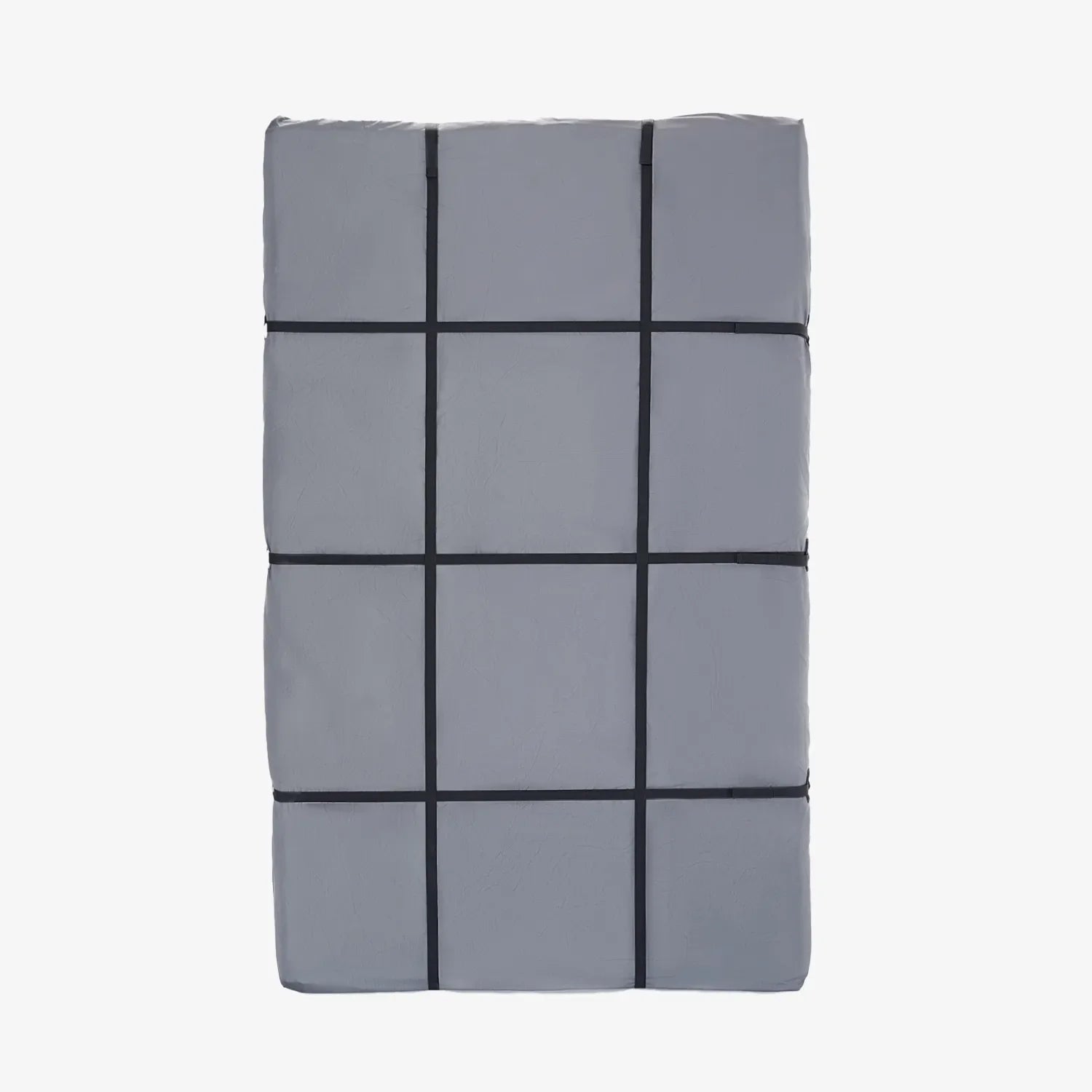 Gray protective cover for rooftop tent, secured with black straps in a grid pattern.