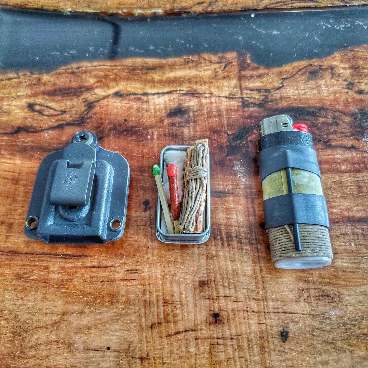 Survival Kit Lighter - Fire Starter outfitted with supplies.