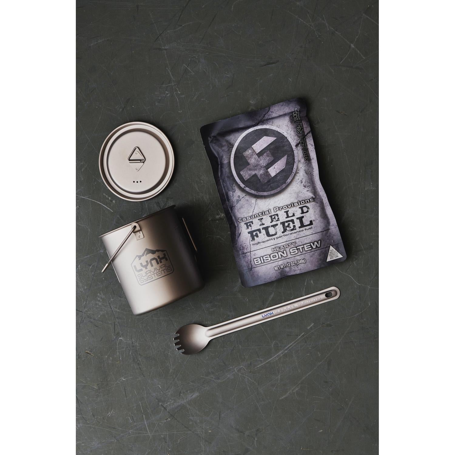 LYNX VECTOR 750ml titanium ultralight pot with lid, titanium spork, and "Field Fuel" meal pouch.