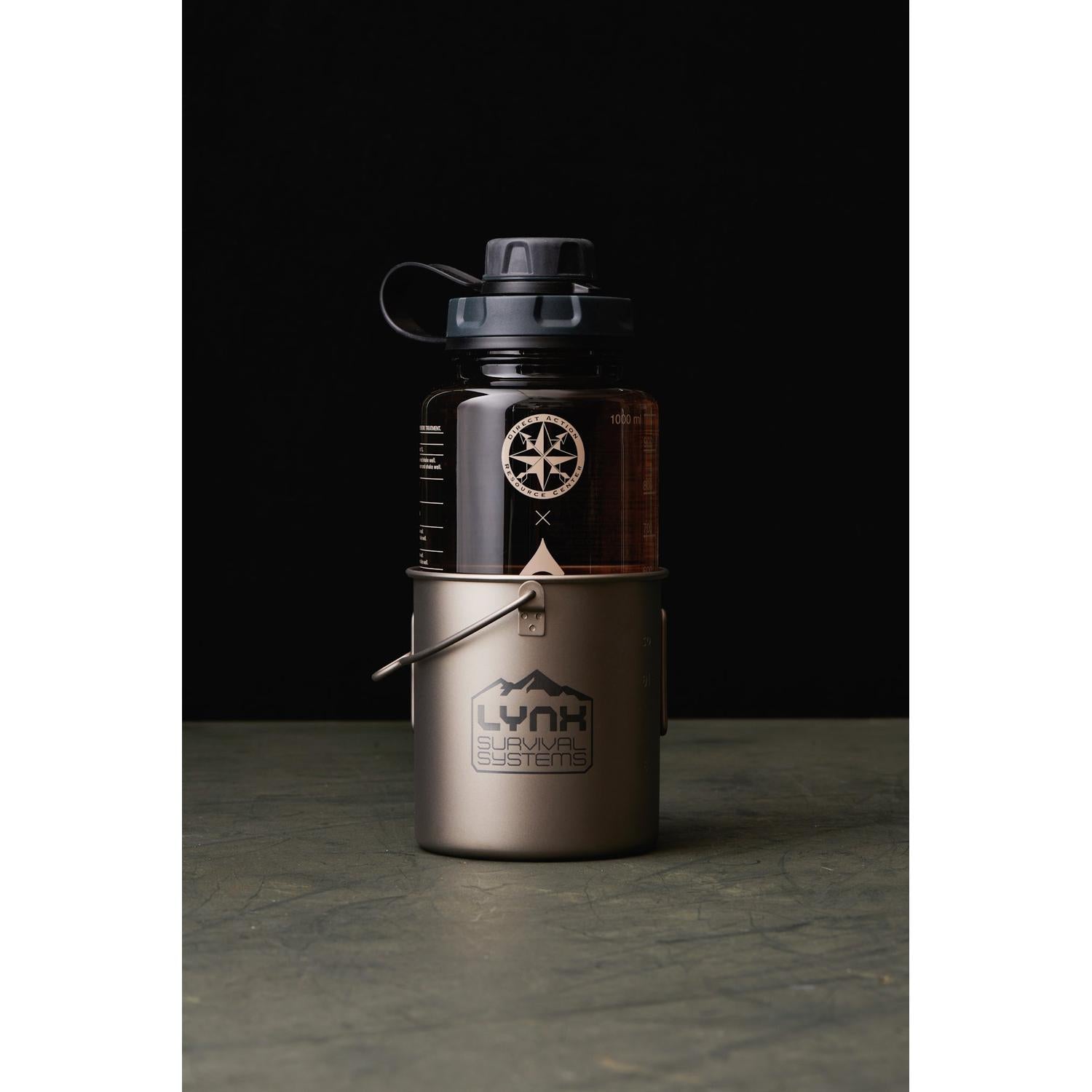 LYNX VECTOR 750ml titanium ultralight pot with lid, nesting a dark Nalgene bottle.