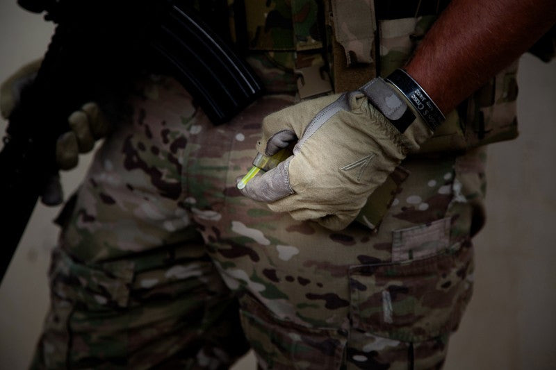Gloved hand dispensing a marking light from a MARCO dispenser