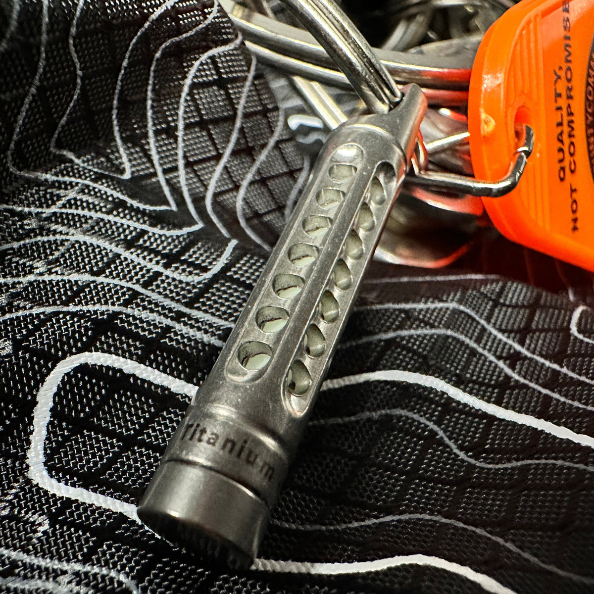Titanium cage and removable UGM glow rod shown separately
