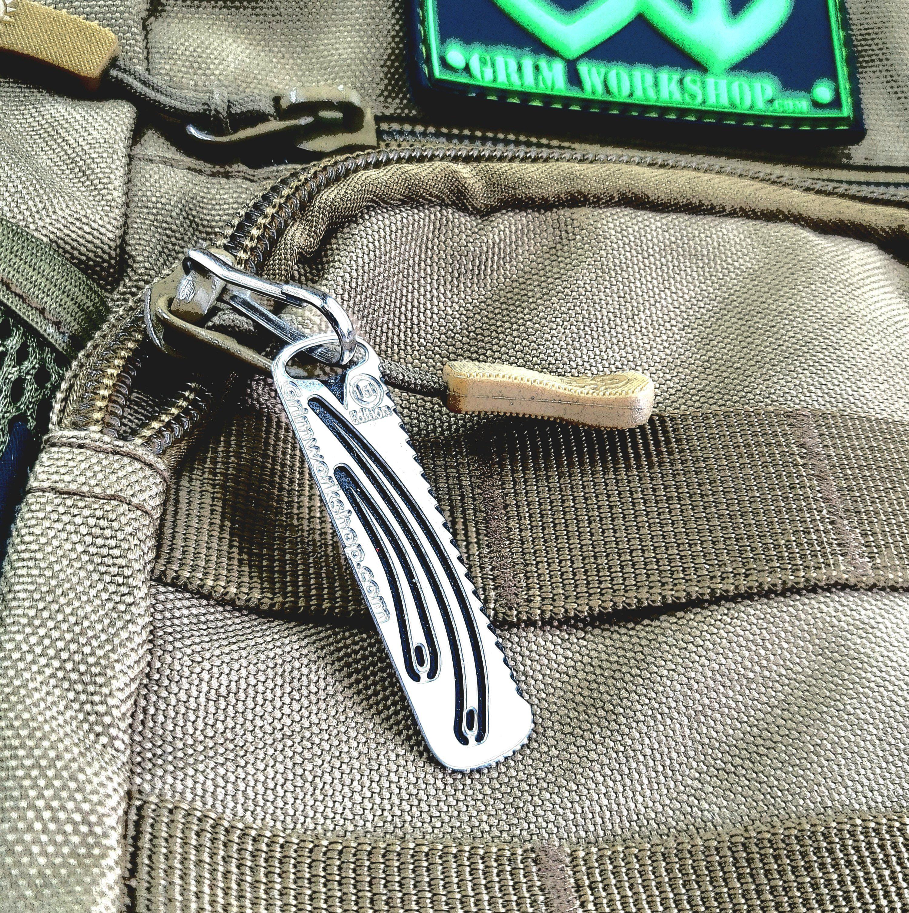 First aid micro tool shown at scale for pocket carry
