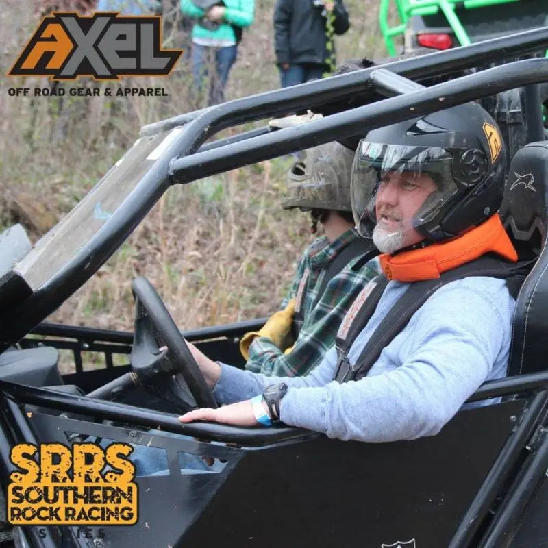 Rider wearing AXEL Off Road Neck Brace in a UTV