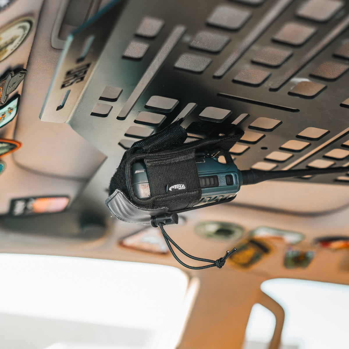 Rugged Radios R-POUCH attached to an overhead vehicle panel; radio and panel not included